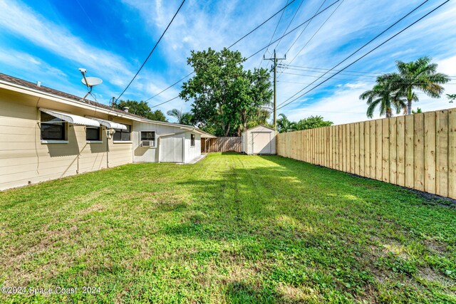 view of yard with a storage shed