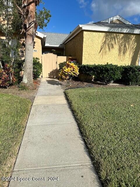 view of side of home featuring a yard