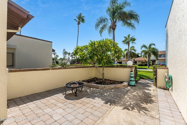 view of patio with an outdoor fire pit