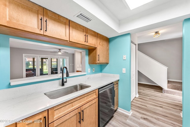 kitchen featuring stainless steel dishwasher, beverage cooler, ceiling fan, sink, and light hardwood / wood-style flooring