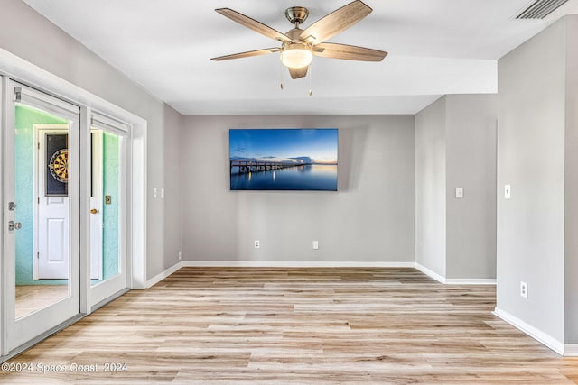 unfurnished room featuring ceiling fan and light hardwood / wood-style flooring