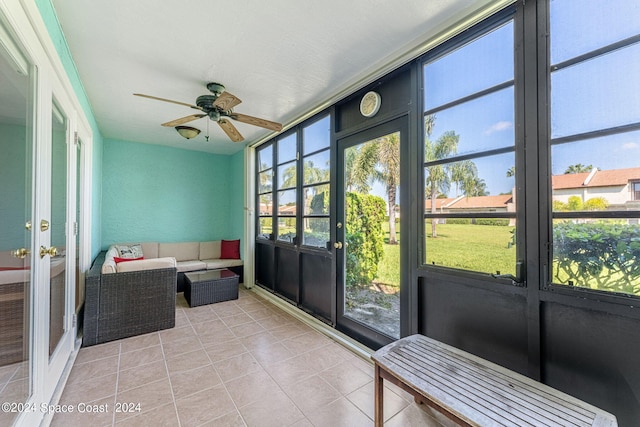 sunroom / solarium with ceiling fan