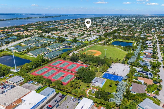 birds eye view of property with a water view