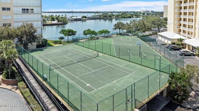 view of sport court featuring a water view