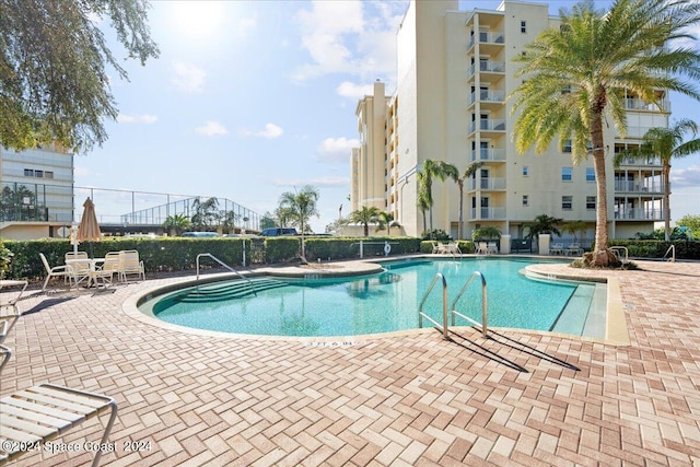 view of swimming pool featuring a patio