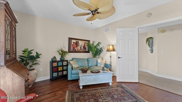 sitting room with ceiling fan and dark hardwood / wood-style flooring