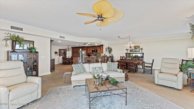 tiled living room with crown molding, a textured ceiling, and ceiling fan with notable chandelier