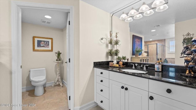 bathroom with vanity, toilet, and walk in shower