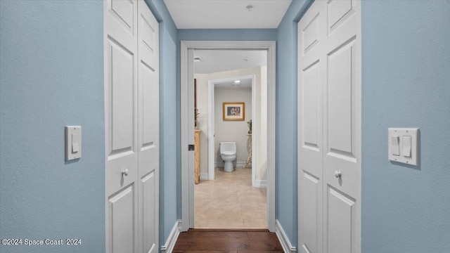 hall featuring dark wood-type flooring