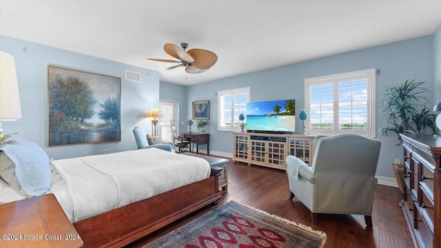 bedroom featuring dark hardwood / wood-style floors and ceiling fan