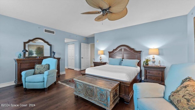 bedroom featuring a closet, ceiling fan, and dark hardwood / wood-style floors