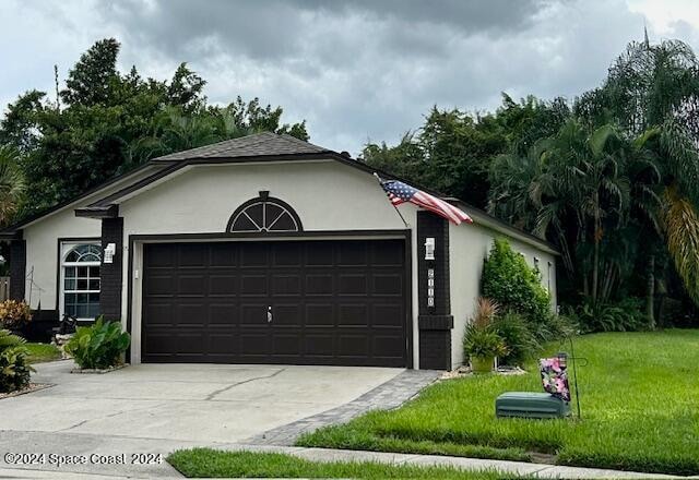 garage featuring a yard