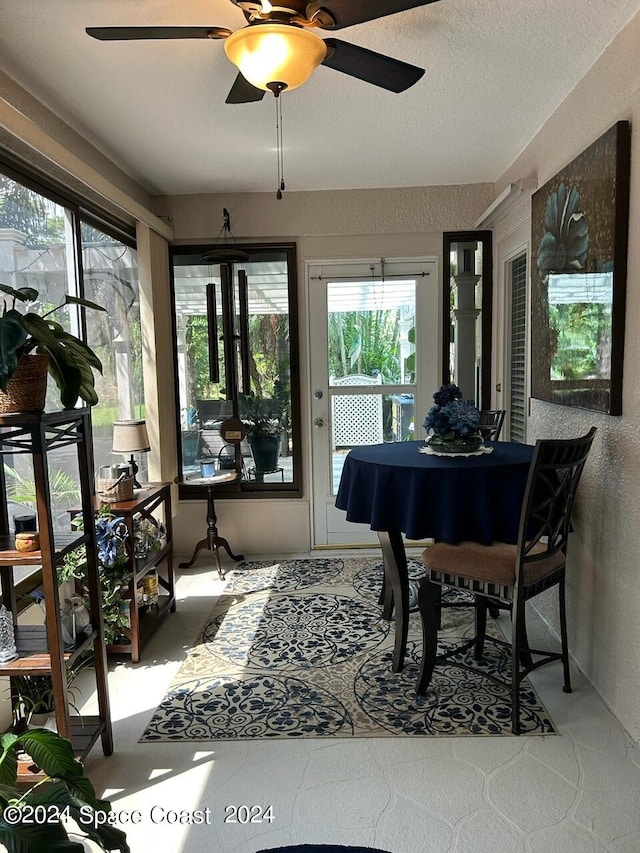 sunroom / solarium with ceiling fan