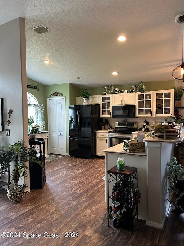 kitchen with lofted ceiling, dark wood-type flooring, black appliances, white cabinets, and kitchen peninsula