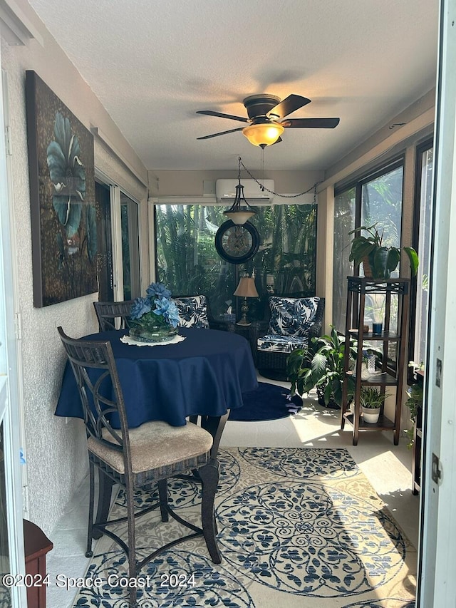 sunroom / solarium featuring ceiling fan