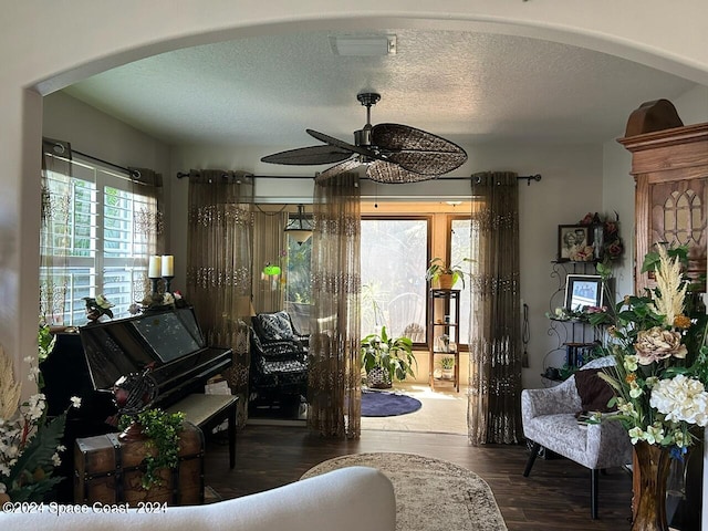 miscellaneous room with a textured ceiling, dark hardwood / wood-style floors, and ceiling fan