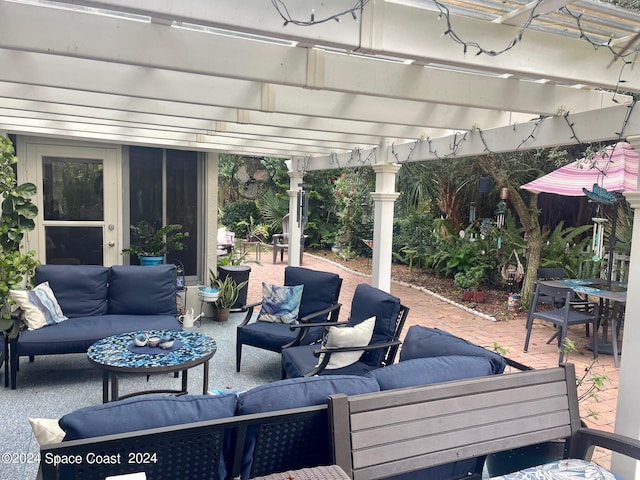 view of patio with outdoor lounge area and a pergola