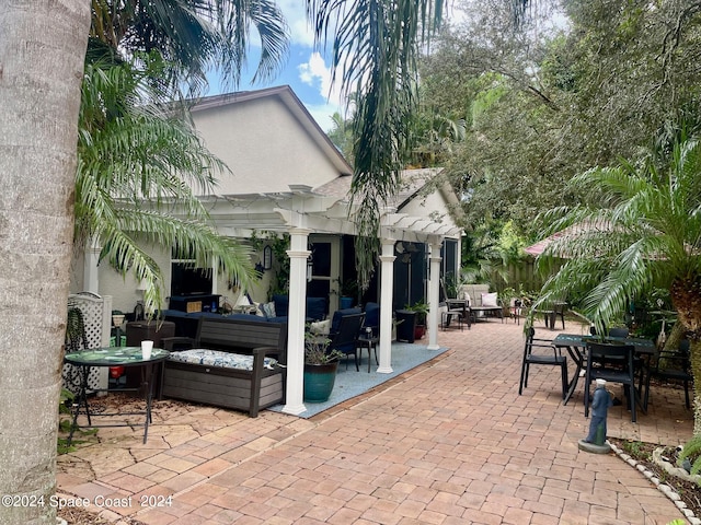 view of patio / terrace with a pergola and outdoor lounge area