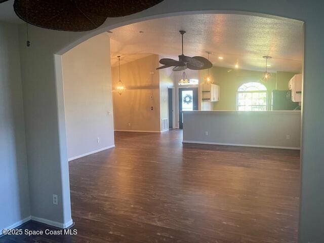 unfurnished living room featuring ceiling fan