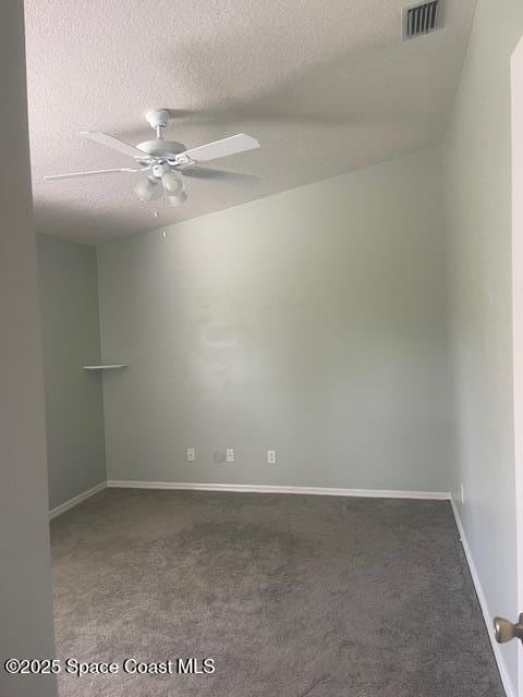 carpeted empty room with a textured ceiling and ceiling fan