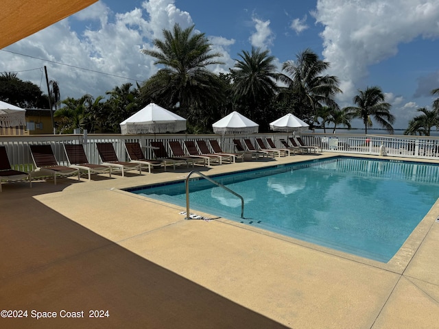 view of swimming pool with a patio area