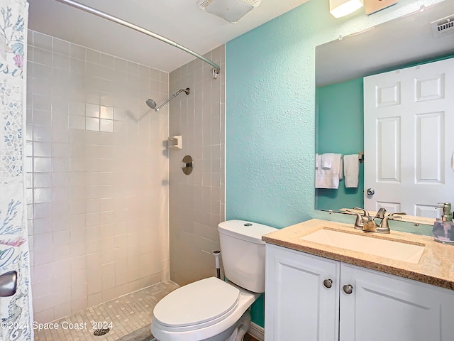 bathroom with vanity, toilet, and a shower with shower curtain