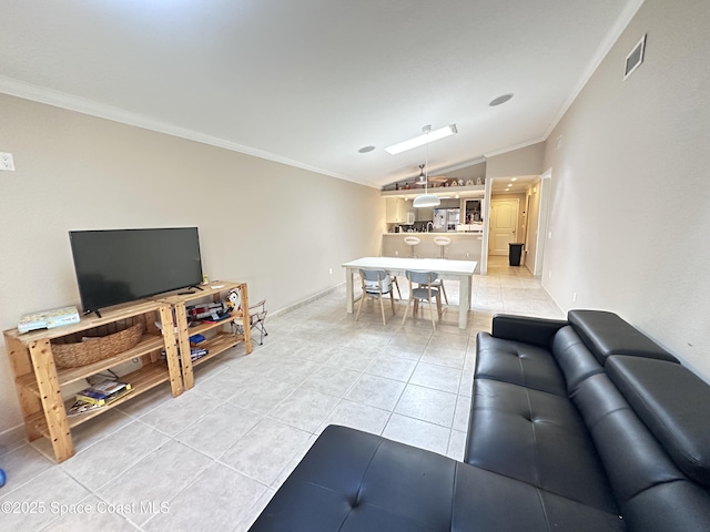 living room with vaulted ceiling, light tile patterned flooring, crown molding, and baseboards