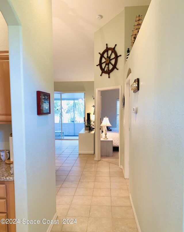 hallway with light tile patterned flooring