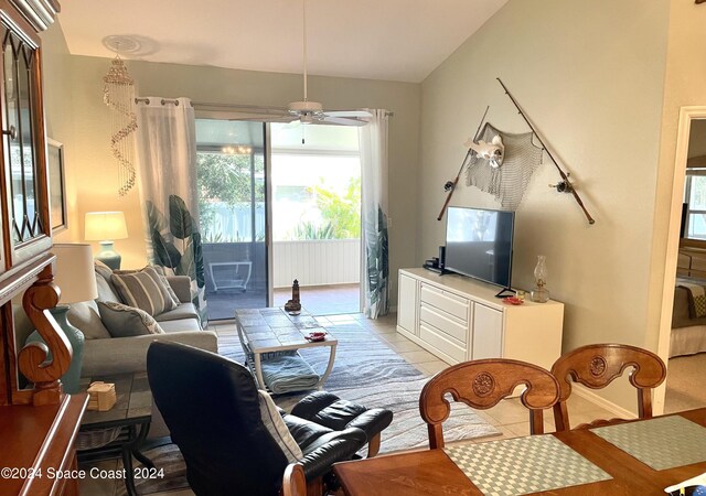 living room featuring ceiling fan and light tile patterned floors