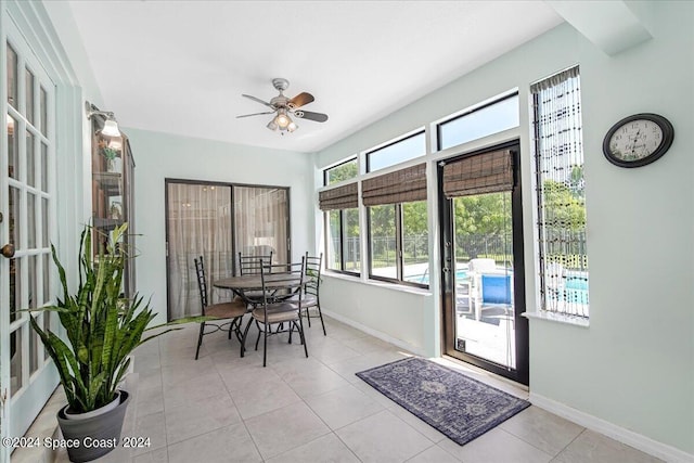 sunroom / solarium featuring ceiling fan