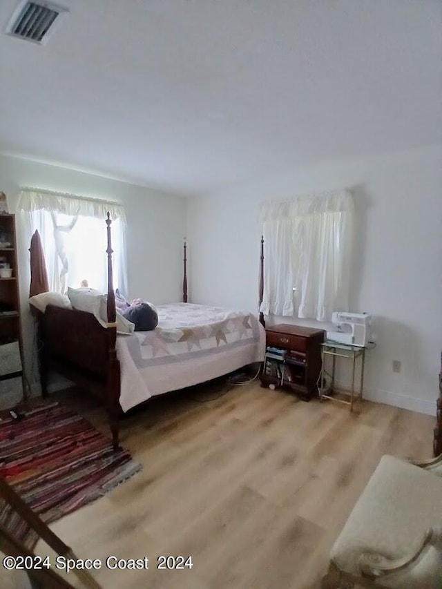 bedroom with light wood-type flooring