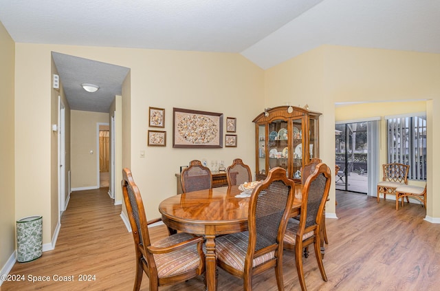 1531 Independence Ave, Melbourne, FL 32940 - dining space featuring baseboards, light wood-type flooring, and vaulted ceiling