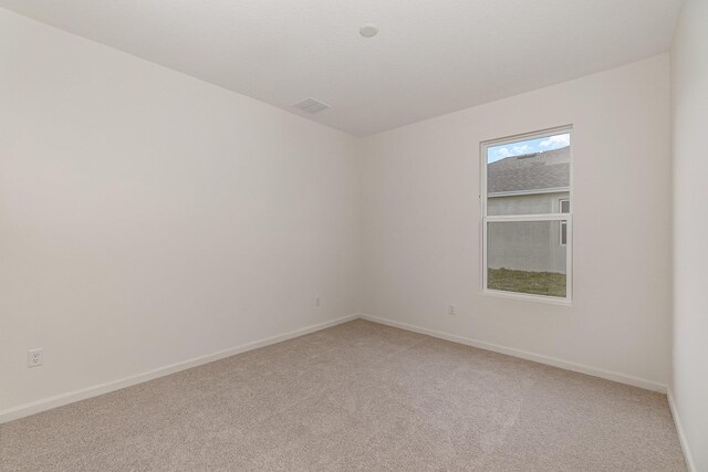 unfurnished room featuring carpet flooring