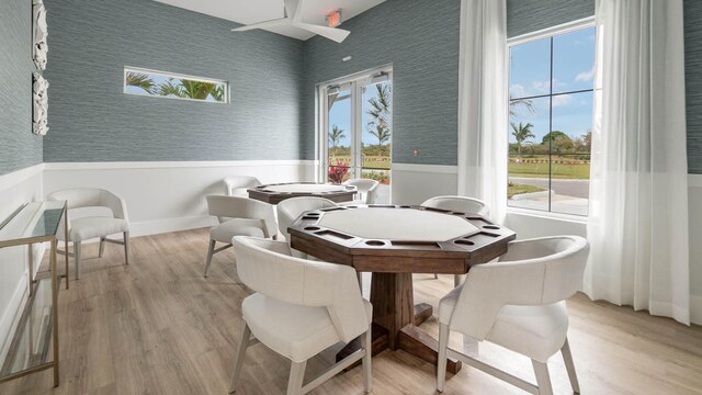 dining space featuring plenty of natural light and light wood-type flooring