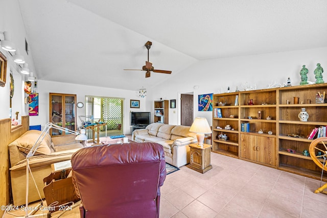 living room with vaulted ceiling, ceiling fan, and light tile patterned floors