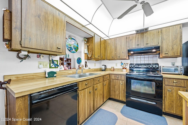 kitchen with black appliances, sink, light tile patterned floors, and ceiling fan