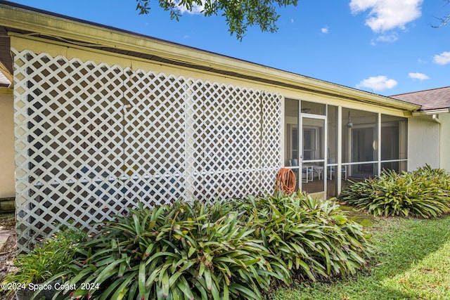 exterior space featuring a sunroom