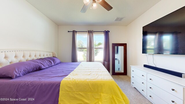 carpeted bedroom with ceiling fan