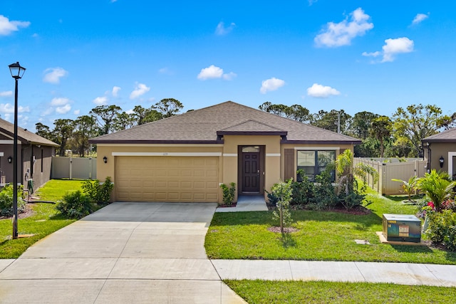 view of front facade featuring a garage and a front lawn