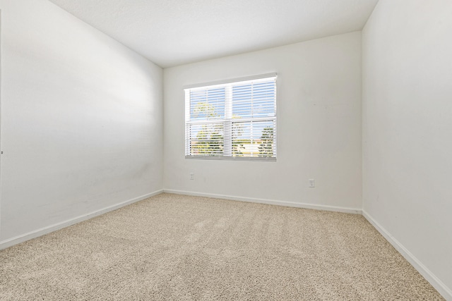 empty room featuring carpet flooring