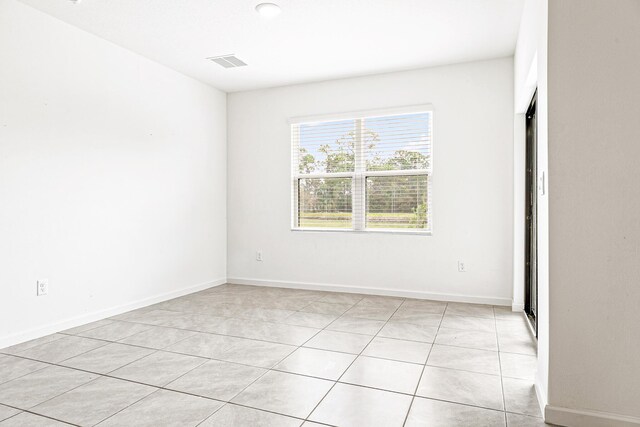 view of tiled spare room