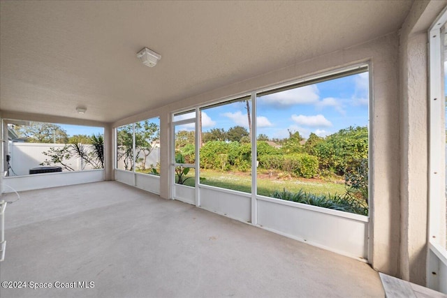 unfurnished sunroom with a wealth of natural light