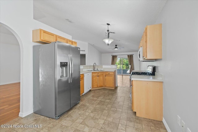 kitchen with ceiling fan, sink, hanging light fixtures, white appliances, and light brown cabinetry