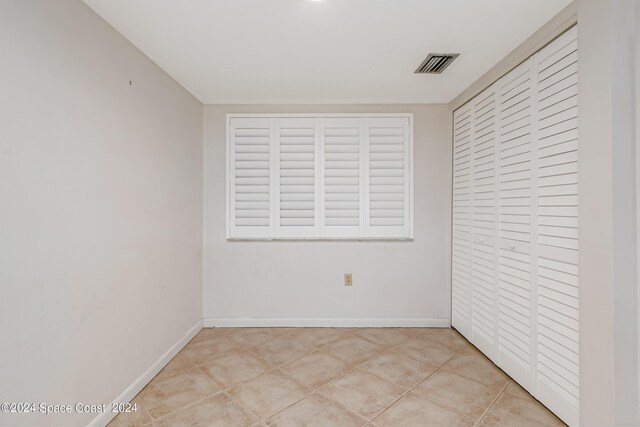 unfurnished bedroom featuring light tile patterned floors