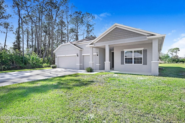 view of front of property with a front yard and a garage