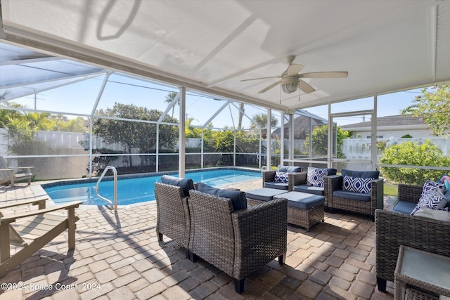 exterior space featuring a pool, ceiling fan, and a wealth of natural light