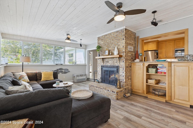 living room featuring wood ceiling, light hardwood / wood-style floors, ceiling fan, and a fireplace