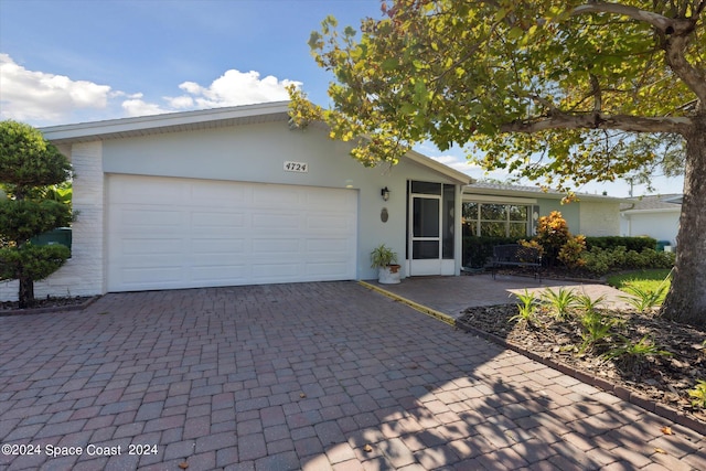 single story home featuring a garage