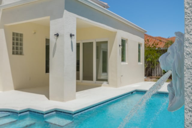 view of swimming pool with a patio area