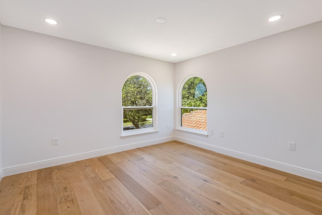 spare room with light wood-type flooring